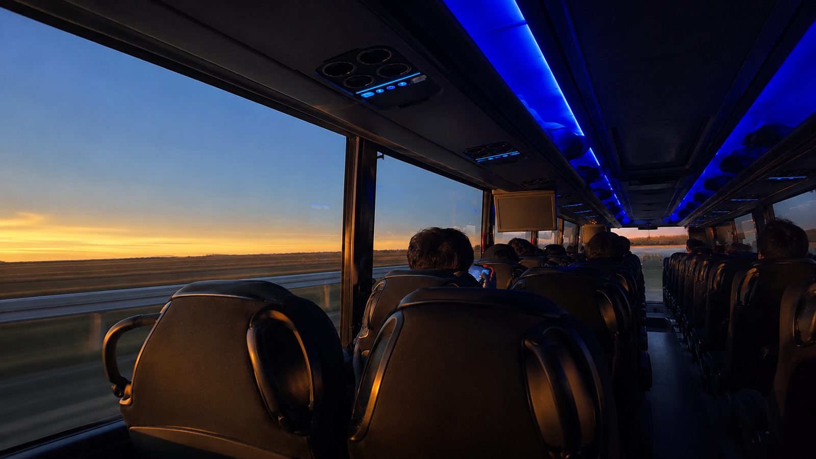 Interior of an EvolveLimo executive coach in warm evening light